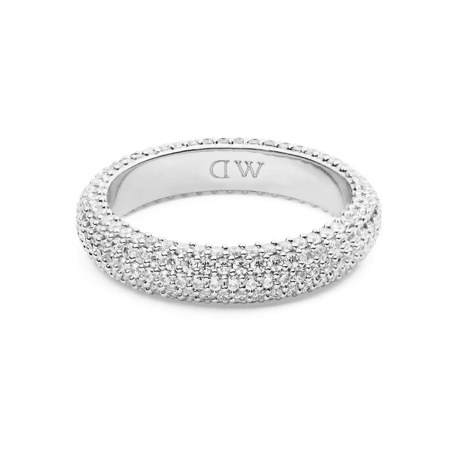 The Pavé Ring Silver 5 mm features a wide band with a multi-row pavé setting of sparkling white crystals, offering a modern and elegant silver finish suitable for everyday wear or special occasions.