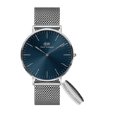 Silver mesh strap watch with a blue dial and matching silver Elan Ring S, both featuring minimalist styling and Daniel Wellington branding, ideal for gifting or everyday wear.