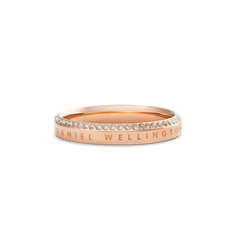 Classic Aura Ring Rose Gold featuring a slim rose gold band with a row of white crystals set along the chamfered edge and subtle engraved branding for a refined, elegant finish.