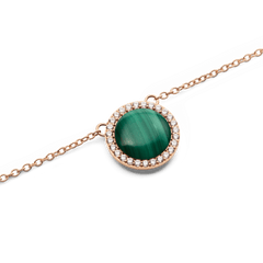 Close-up of the Audrey Necklace Malachite Rose Gold pendant, showcasing a domed green malachite stone encircled by sparkling white cubic zirconia crystals on a fine rose gold chain.