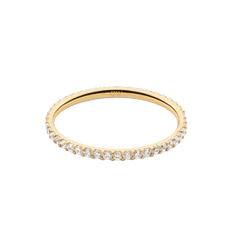 The Mirelle Eternity Ring Gold 1.4 mm displays a slim gold band with a continuous circle of white cubic zirconia crystals, offering a timeless and versatile jewellery option.