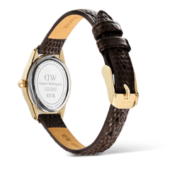 Rear view of the Ophelia Mini Dark Brown Lizard White Guilloché Gold watch, showing the gold case back, engraved details, and the adjustable dark brown lizard-embossed leather strap with a gold pin buckle.