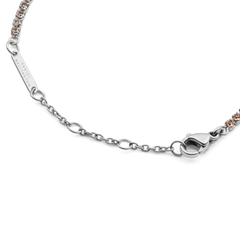 Detail of the Classic Tennis Bracelet Apricot Silver showing the adjustable sizing rings, lobster clasp, and individually set apricot-coloured crystals on a sleek silver chain.