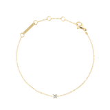 Delicate gold bracelet featuring a slim adjustable chain with a single white cubic zirconia stone set at the centre, designed for a refined and minimalist look.