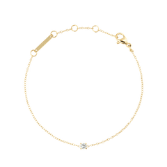 Delicate gold bracelet featuring a slim adjustable chain with a single white cubic zirconia stone set at the centre, designed for a refined and minimalist look.