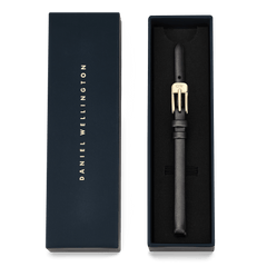 Pressed Sheffield Strap Gold presented in a navy Daniel Wellington gift box, featuring a slim black leather strap with a gold buckle, ideal for smaller watch faces and an elegant, minimalist upgrade.