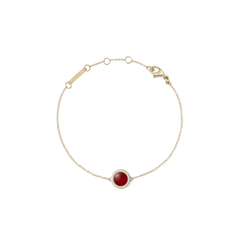 Delicate gold bracelet featuring a slim adjustable chain and a central domed red agate stone, surrounded by a halo of sparkling white cubic zirconia crystals.