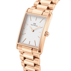 Bound 3-Link Rose Gold watch with a rectangular rose gold case, minimalist white dial, and polished 3-link bracelet, shown in a close-up angle highlighting its geometric edges and refined finish.