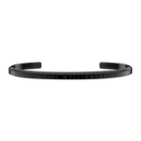 Classic Bracelet in matte black stainless steel with engraved Daniel Wellington branding, featuring a slim open cuff design suitable for men and women.
