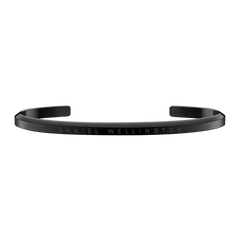 Classic Bracelet in matte black stainless steel with engraved Daniel Wellington branding, featuring a slim open cuff design suitable for men and women.