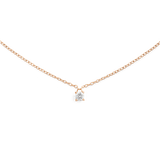 A delicate rose gold necklace featuring a fine chain and a single petite white cubic zirconia solitaire pendant, designed for a minimalist and elegant look.