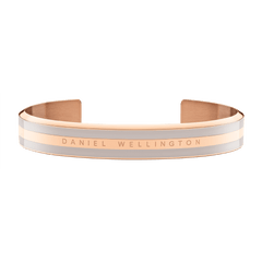 Emalie Bracelet Desert Sand Rose Gold features a wide rose gold cuff with desert sand enamel and Daniel Wellington branding, showcasing a modern minimalist style ideal for everyday wear.