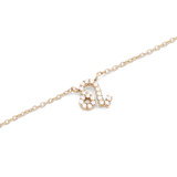 Close-up of the Crystal Zodiac Chain Necklace Gold featuring a Leo zodiac pendant set with sparkling crystals on a fine gold chain.