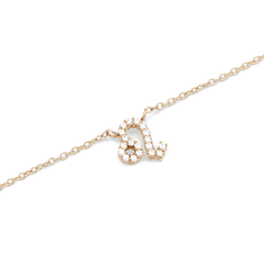 Close-up of the Crystal Zodiac Chain Necklace Gold featuring a Leo zodiac pendant set with sparkling crystals on a fine gold chain.