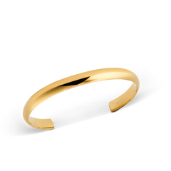 Arch Cuff Gold 6mm shown at an angle, highlighting its polished gold finish, minimalist curved silhouette and open-ended design for easy adjustment.