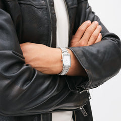 Bound 3-Link Silver watch worn with a black leather jacket, highlighting its rectangular stainless steel case and three-link silver bracelet for a stylish, modern look suitable for men.