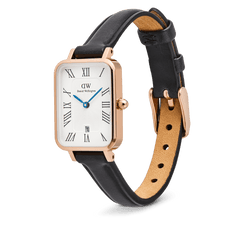 Quadro Roman Numerals Date Sheffield Rose Gold ladies watch with a rectangular rose gold case, white dial featuring Roman numerals and blue hands, date window at six o’clock, and a slim black genuine leather strap with pin buckle.