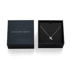 Crystal Zodiac Chain Necklace Silver displayed in an open designer gift box, featuring a delicate silver chain and a Scorpio zodiac pendant adorned with sparkling hand-set crystals.