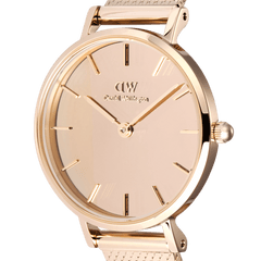 Close-up of the Daniel Wellington Petite Reflection Rose Gold watch highlighting the mirror-effect rose gold dial, minimalist hour markers, and polished case detailing.
