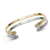 Classic Lumine Bracelet Silver + Gold set featuring two slim stainless steel cuff bracelets, one in polished gold and one in silver, each adorned with sparkling crystals along the band and designed for comfortable everyday wear.