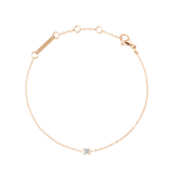 Delicate rose gold bracelet with a fine adjustable chain, featuring a single white cubic zirconia crystal in a minimal setting at the centre.
