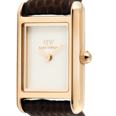 Close-up of the Bound Mini Dark Brown Lizard Rose Gold watch showing the polished rose gold rectangular case, minimalist white dial, and textured brown lizard-grain leather strap.