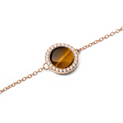 Close-up of the Audrey Bracelet Tiger Eye Rose Gold, highlighting the round tiger eye stone framed by a row of sparkling white cubic zirconia on a fine rose gold chain.