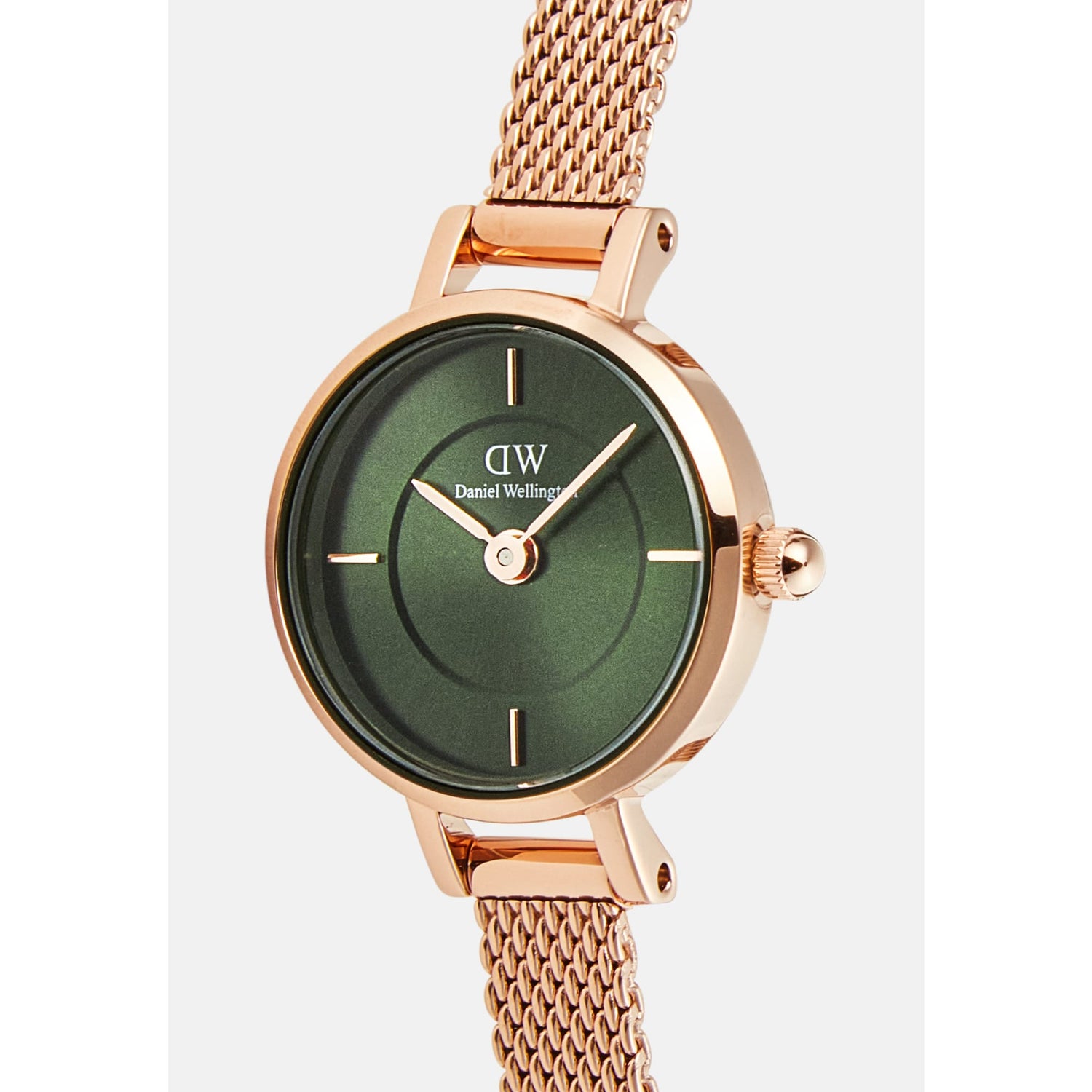 Close-up of the Petite Mini Emerald Melrose watch highlighting the emerald green sunray dial with inner ring detail, petite rose gold case, and slim rose gold mesh strap.