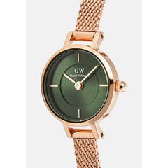 Close-up of the Petite Mini Emerald Melrose watch highlighting the emerald green sunray dial with inner ring detail, petite rose gold case, and slim rose gold mesh strap.