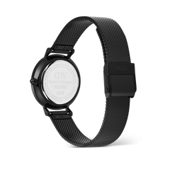 Daniel Wellington Petite Reflection Black watch showing the engraved stainless steel case back and adjustable black mesh strap with a secure clasp.