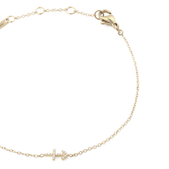 Crystal Zodiac Chain Bracelet Gold featuring a slim gold chain, adjustable sizing rings, and a sparkling crystal zodiac charm, finished with a secure lobster clasp.