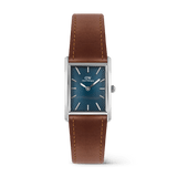 Rectangular men's watch with a polished silver case, deep blue guilloché dial, and light brown leather strap with visible stitching, showcasing the refined and versatile style of the Daniel Wellington Bound Light Brown Arctic Guilloché Silver.