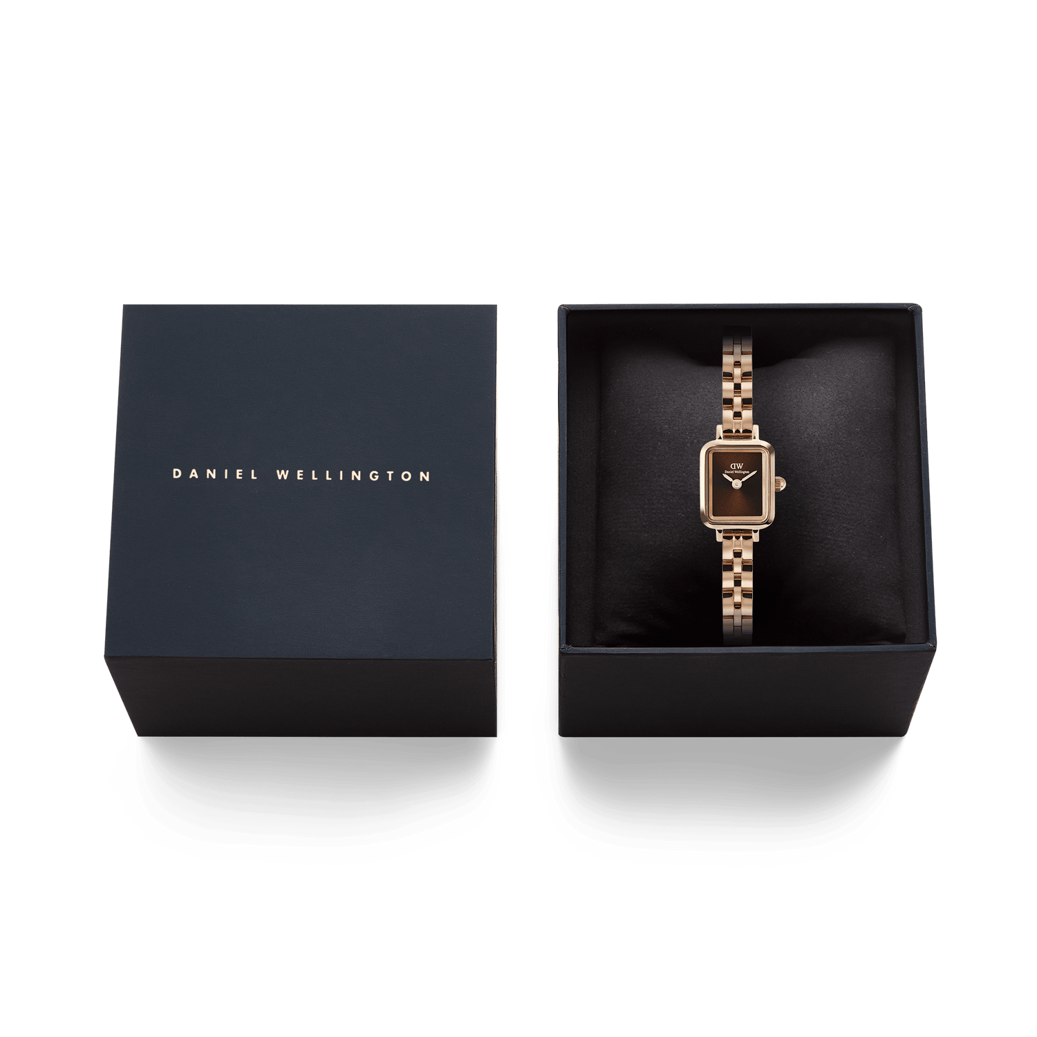 Quadro Mini Arch 3-link Amber Sunray Rose Gold ladies watch presented in a sleek Daniel Wellington gift box, featuring a rectangular brown sunray dial and polished rose gold 3-link bracelet, ideal for gifting or special occasions.