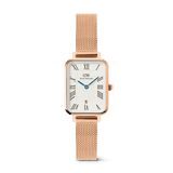 Rose gold ladies watch with a rectangular case, white dial featuring Roman numerals, blue hands, date display at 6 o’clock, and a mesh strap, ideal for everyday elegance and versatility.