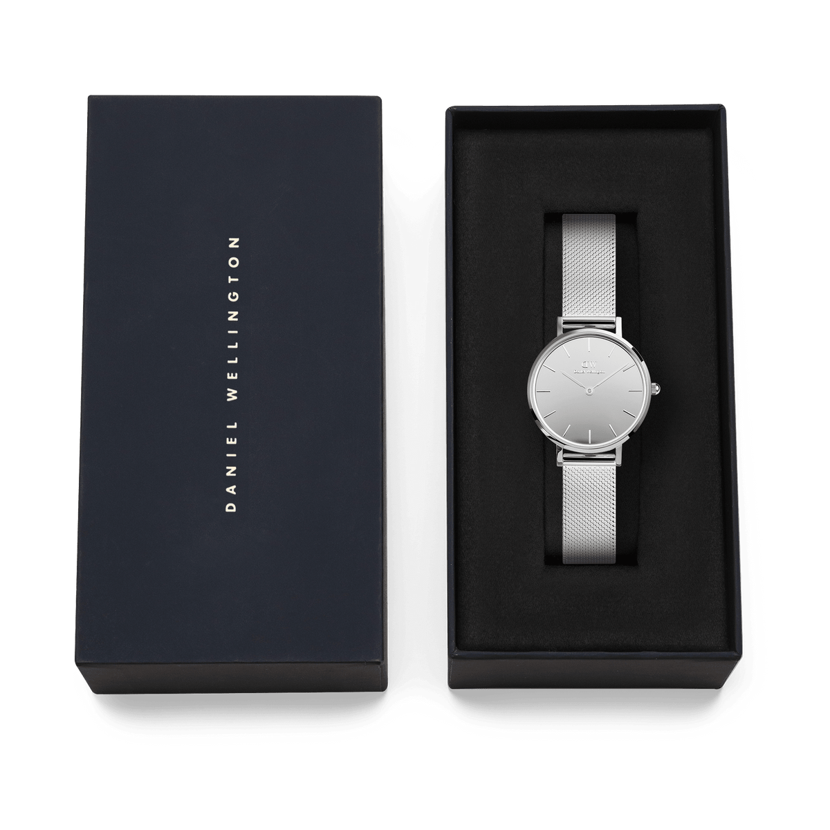 Daniel Wellington Petite Reflection Silver ladies watch with a mirror-finish dial and mesh strap, elegantly presented in a black gift box with the brand name on the lid.
