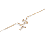 A close-up of the Crystal Zodiac Chain Necklace Gold featuring a Sagittarius pendant set with sparkling crystals on a fine gold chain, highlighting its delicate and modern design.