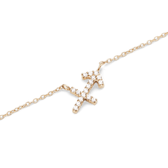 A close-up of the Crystal Zodiac Chain Necklace Gold featuring a Sagittarius pendant set with sparkling crystals on a fine gold chain, highlighting its delicate and modern design.