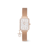 Rectangular rose gold women’s watch with a crystal-framed bezel, white mother of pearl dial, and an adjustable mesh strap, featuring a sparkling zodiac charm attached for a personalised touch.