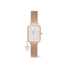 Rectangular rose gold women’s watch with a crystal-framed bezel, white mother of pearl dial, and an adjustable mesh strap, featuring a sparkling zodiac charm attached for a personalised touch.