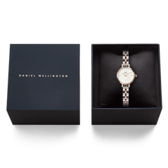 Petite Mini Arch 3-Link Two Tone Rose Gold watch presented in a black Daniel Wellington gift box, highlighting its elegant two tone bracelet and minimalist white dial.
