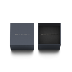 Classic Tennis Necklace Gold presented in a navy Daniel Wellington gift box, highlighting its sparkling crystal design and elegant packaging, ideal for gifting.