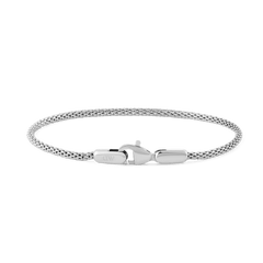 Slim silver mesh bracelet with a lobster clasp, crafted from stainless steel and designed for a comfortable, adjustable fit.