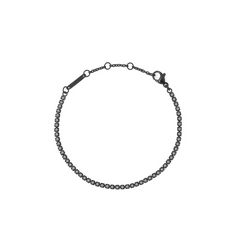Black Crystal Tennis Bracelet featuring a sleek black stainless steel chain with claw-set Preciosa black crystals and adjustable sizing rings for a comfortable fit.
