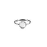 Silver ring with a round mother of pearl centrepiece, surrounded by a halo of white cubic zirconia on a slim, minimalist band.