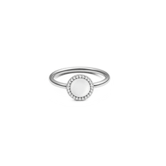 Silver ring with a round mother of pearl centrepiece, surrounded by a halo of white cubic zirconia on a slim, minimalist band.