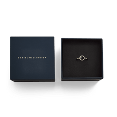 The Audrey Ring Black Agathe Gold displayed in an open Daniel Wellington gift box, highlighting its gold band, black agate centrepiece, and halo of white cubic zirconia crystals.