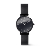 Daniel Wellington Petite Reflection Black watch with a 28mm black mirror glass dial, minimalist hour markers, and a polished black mesh stainless steel strap.