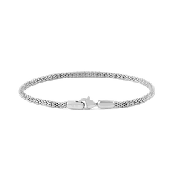 Slim silver mesh bracelet with a lobster clasp, featuring a minimalist design and a refined sterling finish suitable for both men and women.