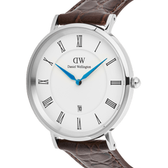 Close-up of the Classic Roman Numerals Date Dark Brown Croc Belly Silver watch, showing the polished silver stainless steel case, white dial with black Roman numerals, blue hands, date display, and a textured dark brown crocodile-embossed leather strap.