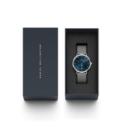 Classic Multi-Eye Sterling Arctic men's watch with a deep blue dial and silver mesh strap, presented in a sleek Daniel Wellington gift box, ideal for gifting or special occasions.
